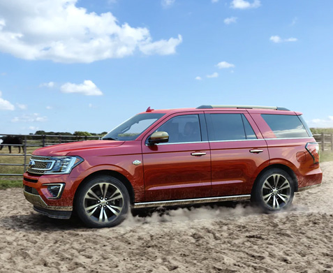 Ford Explorer driving in field