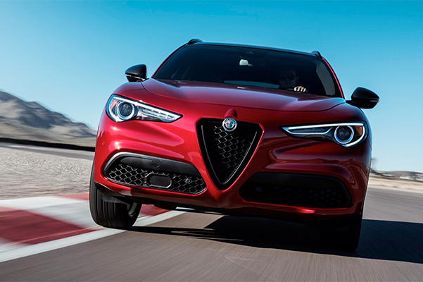A front view of the 2019 Alfa Romeo Stelvio being driven on a track.