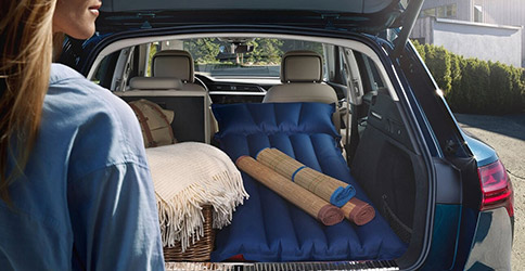 Audi e-tron trunk open showcasing an wide cargo space