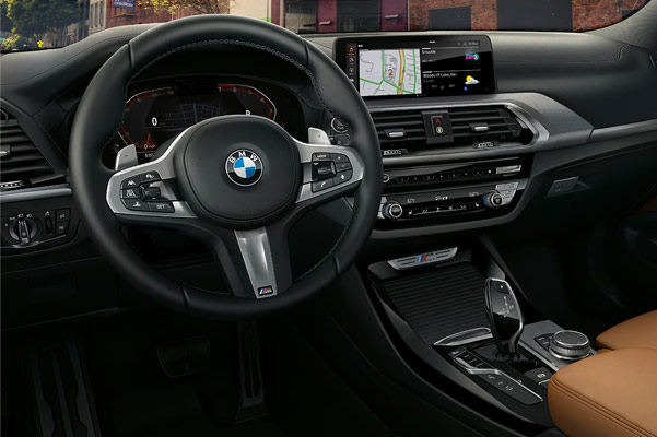 interior view of BMW x3 suv showcasing the driver's dashboard and digital screen