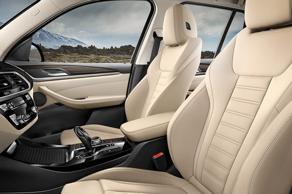 interior view of BMW x3 suv showcasing white leather seats