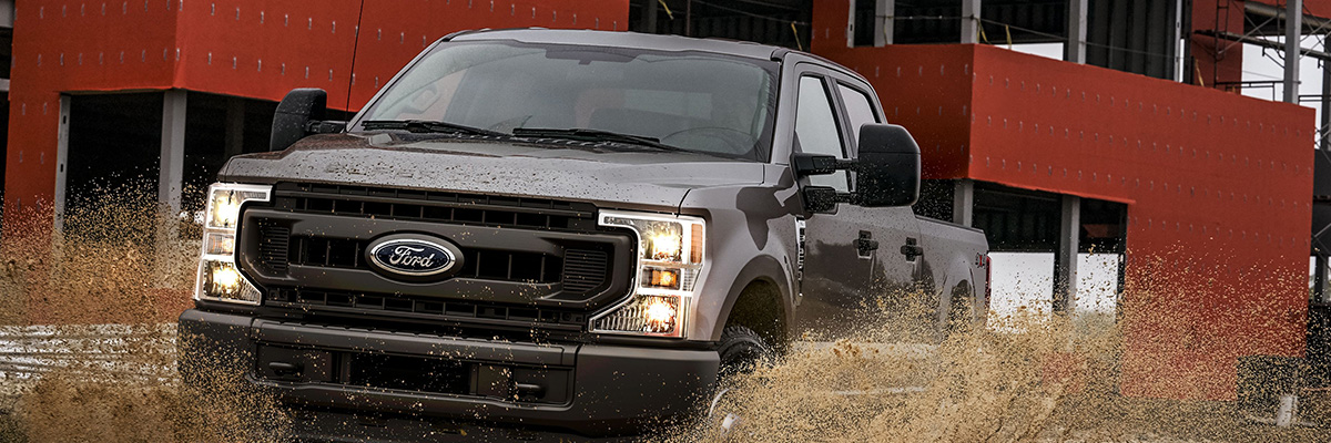 2020 Ford Super Duty driving through mud