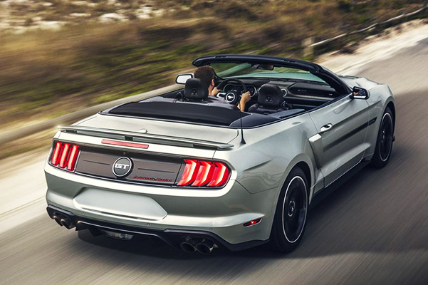 2020 ford mustang with the top down on the highway