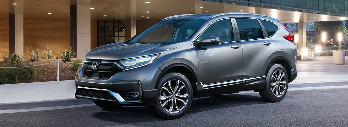 Front driver-side view of the 2020 Honda CR-V Touring in Modern Steel Metallic.