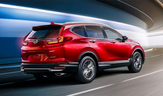 Rear passenger-side view of the 2020 Honda CR-V Touring in Radiant Red Metallic.