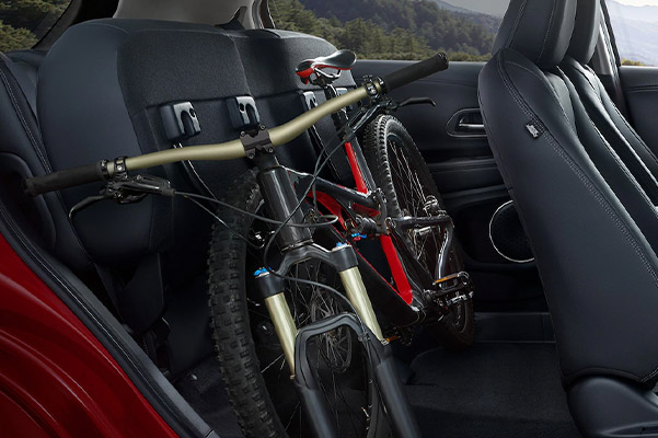 Interior shot of the back seat of a 2020 Honda HR-V folded up to fit a bike