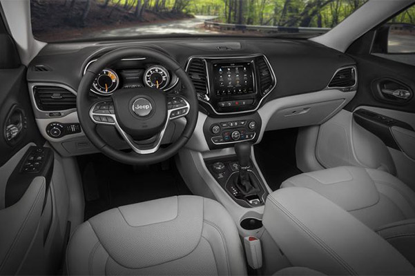 interior view of jeep cherokee vehicle showcasing digita screen and front driver dashboard