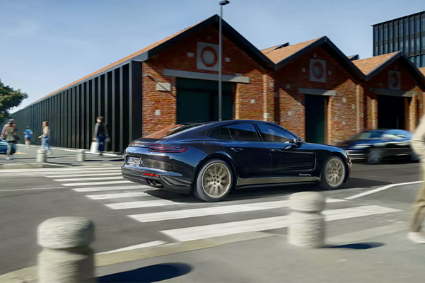 2020 Porsche Panamera driving over crosswalk