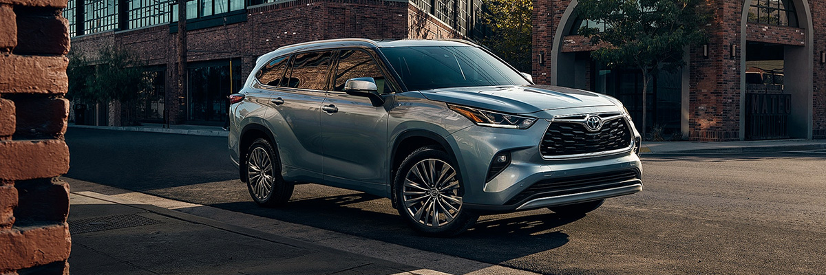 2020 Toyota Highlander driving down a street