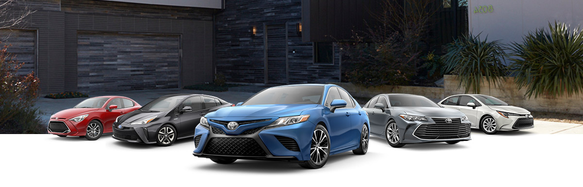 2020 Toyota Sedan Lineup in front of a driveway
