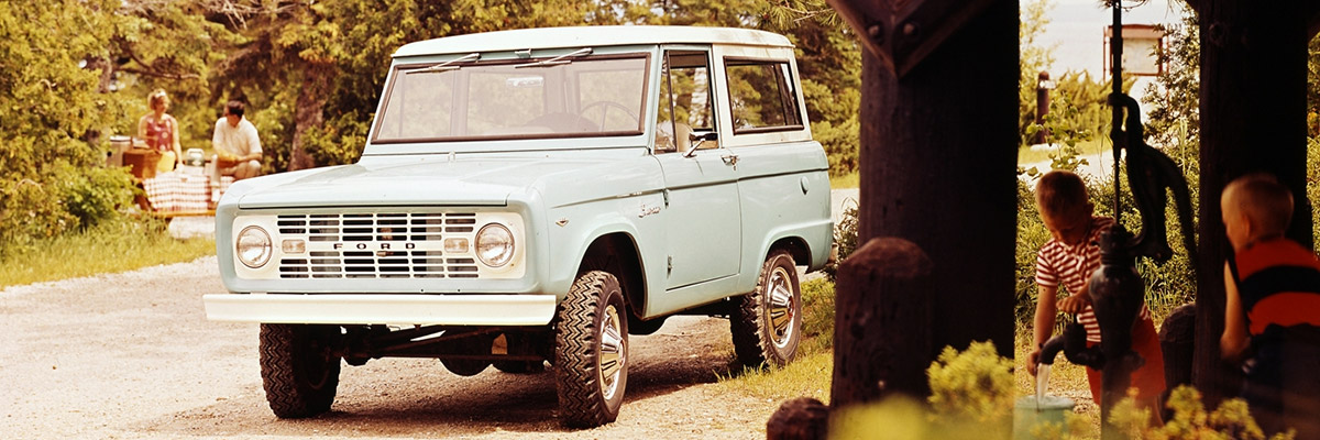 1968 Ford Bronco Sport Wagon in Sky View Blue with a Wimbledon White metal roof.