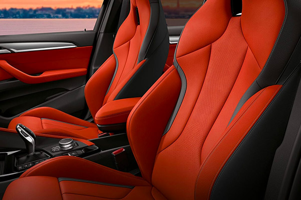 interior shot of 2022 BMW X2 suv featuring red leather seats