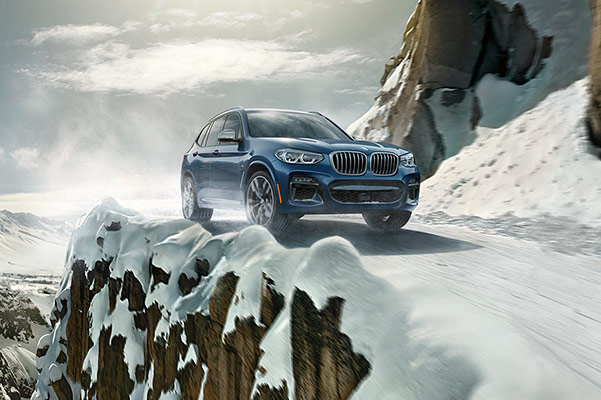 interior view of BMW x3 suv showcasing the driver's dashboard and digital screen