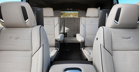inteior view of 2021 cadillac escalade suv featuring white leather seats and amp leg room