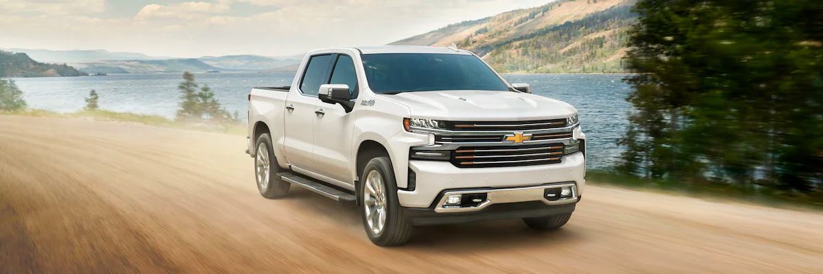 2021 Chevy Silverado 1500 driving down dirt road by water