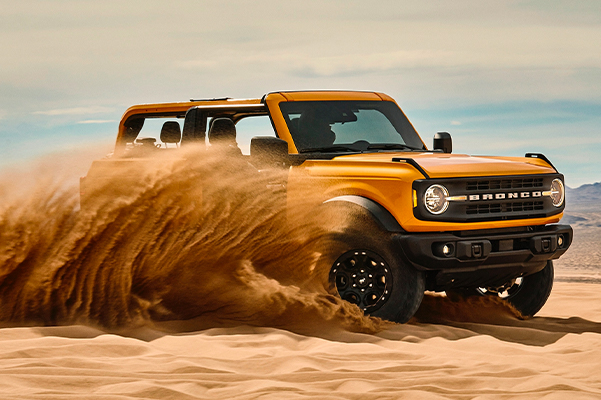 2021 Ford Bronco being driven through the sand dunes
