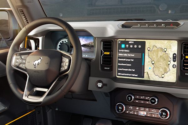 Interior of the 2021 Ford Bronco with mountain landscape through windows