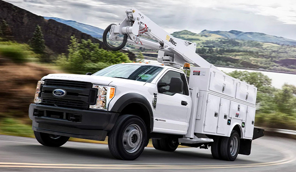 A Ford Commercial F-550 truck on the road