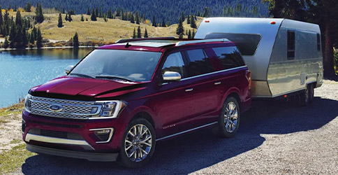 2021 Ford Expedition with available Panoramic vista roof towing a trailer