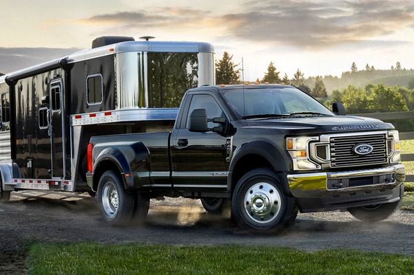 new ford f-250 hauling a trailer on the road