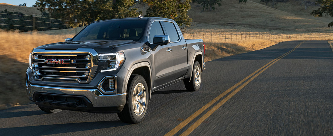 2021 GMC Sierra 1500 driving down a rural road