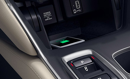 a smarth phone being charged wirelessly on the 2021 honda accord