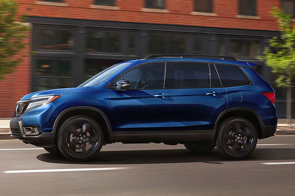 2021 Honda Passport driving through the city