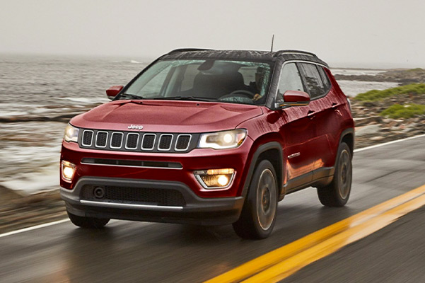 2021 jeep compass driving on a wet road