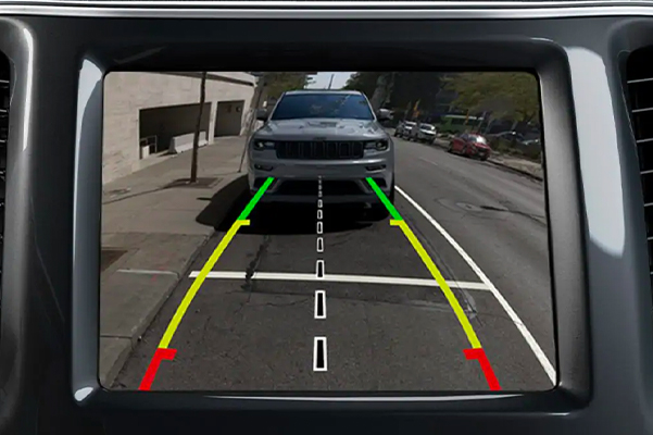 A close-up of the touchscreen in the 2021 Jeep Cherokee displaying the view from the rear camera.