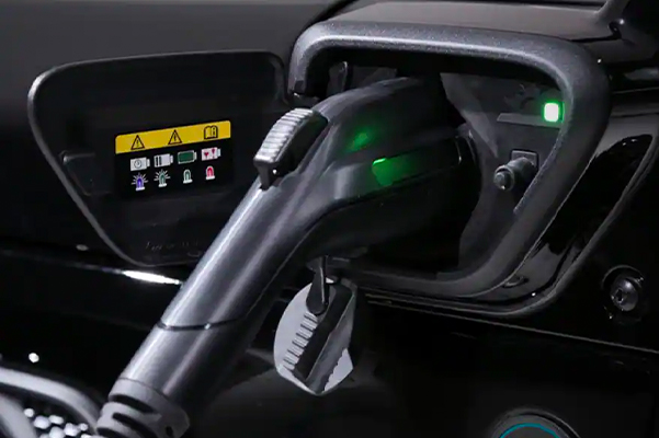 The charging port on the 2021 Jeep Wrangler 4xe, with the charger plugged in