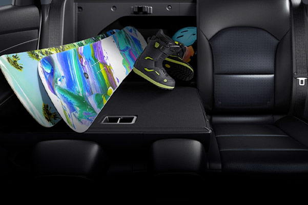 2021 Kia Forte rear seats folded down with snowboards