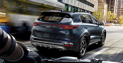 rear view of the 2021 kia sportage on a road in the city