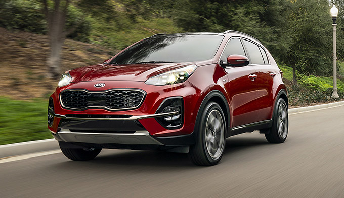 Kia Sportage driving on road.