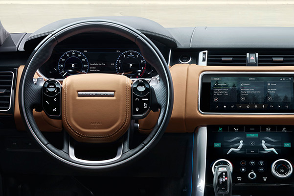 Interior dashboard of a 2021 Range Rover Sport with touchscreen and dual climate control