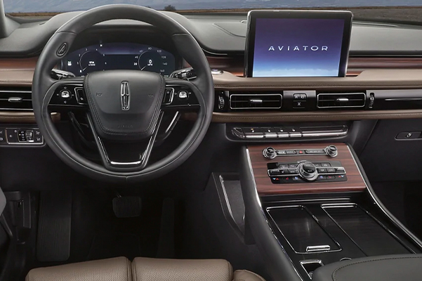 The dashboard of a 2021 Lincoln Aviator is shown demonstrating the continuous and uninterrupted space within the cabin