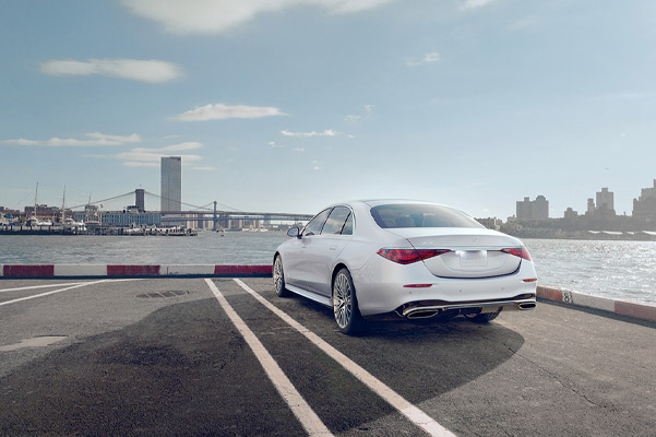 Mercedes-Benz S-Class rear view, parked with city scape background