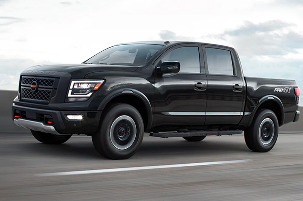 2021 Nissan TITAN PRO-4X in black showing Intelligent Around View coverage on a highway