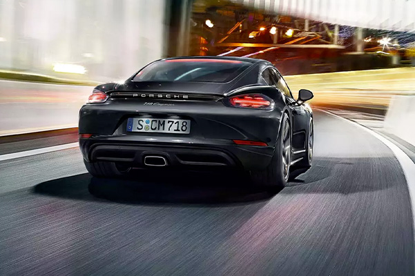 rear view of the 2022 Porsche 718 Cayman driving down the road