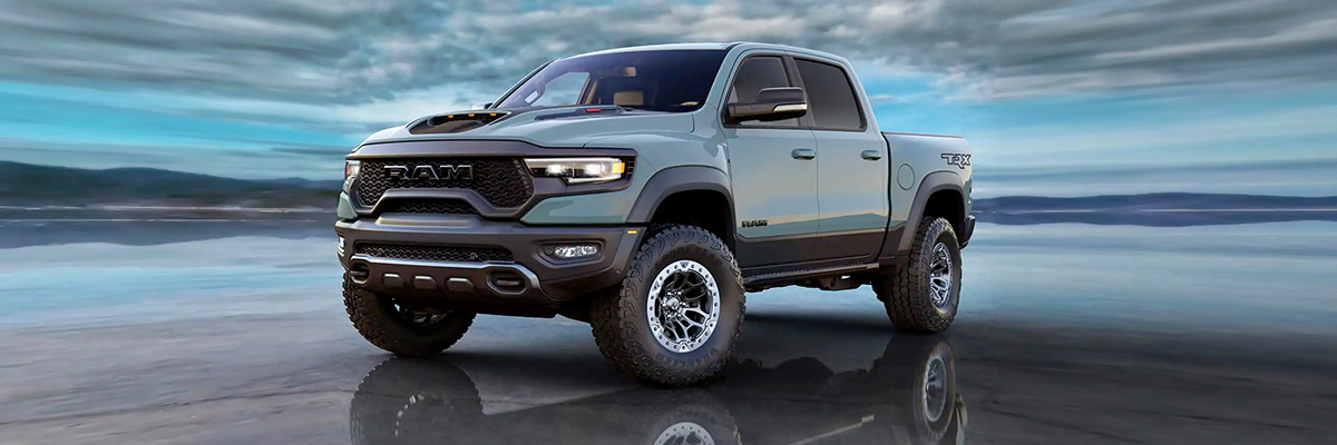 Display The 2021 Ram 1500 TRX parked with a stormy sky behind it.