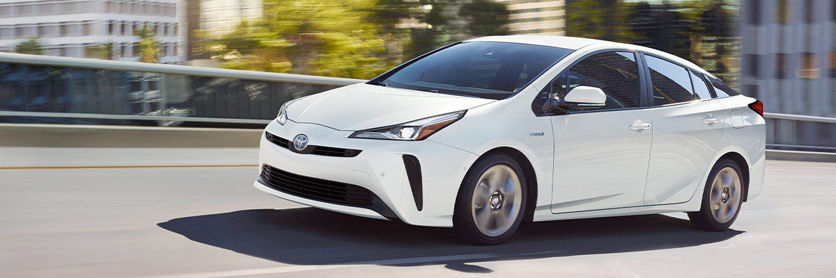 2021 Toyota Prius white front driving on road