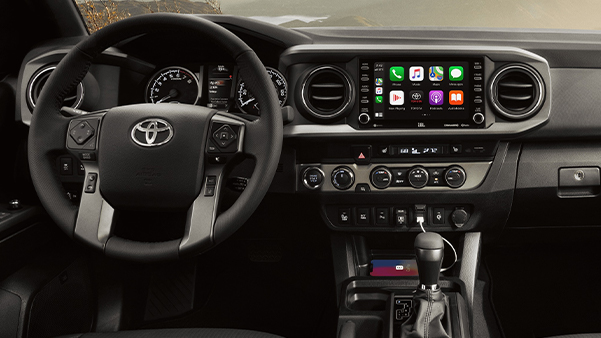 TRD Off-Road interior shown in Black leather trim with available TRD Off-Road Premium Package and Advanced Technology Package. Apple CarPlay® screen shown