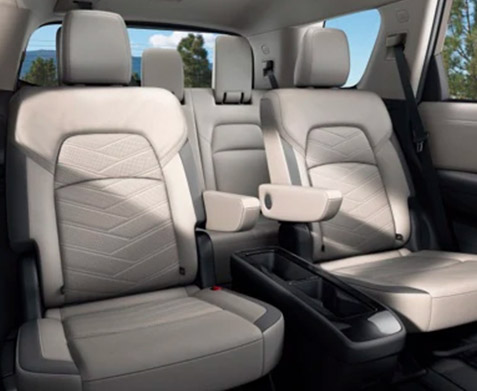 interior view of 2022 nissan pathfinder suv featuring captain chairs in white leather