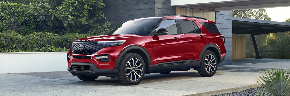 red 2022 Ford Explorer parked in front of a house