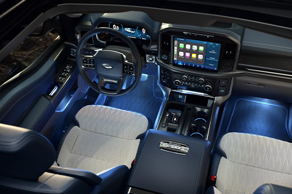 Overhead view of a 2022 Ford F-150 interior with ambient lighting in cool Ice Blue®