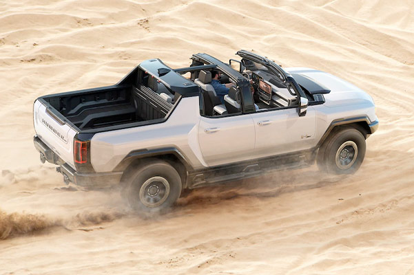 2022 HUMMER EV riding on sand