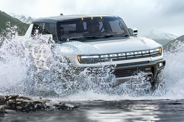 2022 HUMMER EV splashing through water