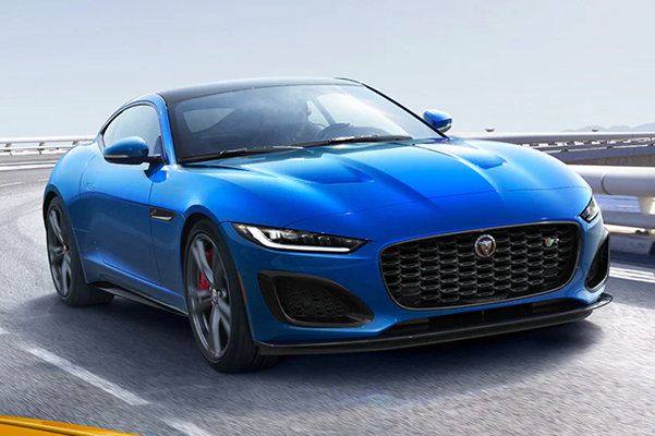 Velocity Blue F-TYPE driving on road..