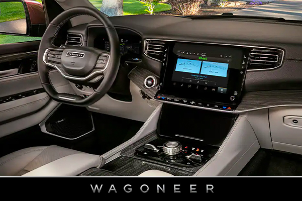 The steering wheel and Uconnect touchscreen in the 2022 Wagoneer.