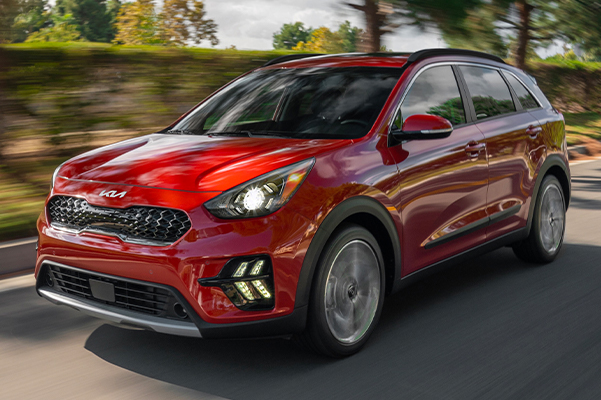2022 Kia Niro Hybrid Driving Down A Suburban Street Three-Quarter View