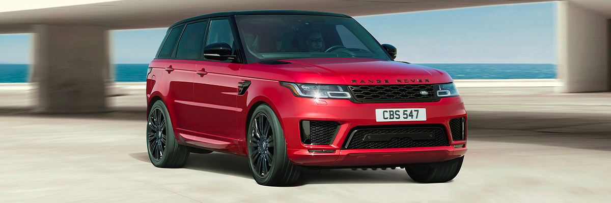 red 2022 land rover range rover sport in motion